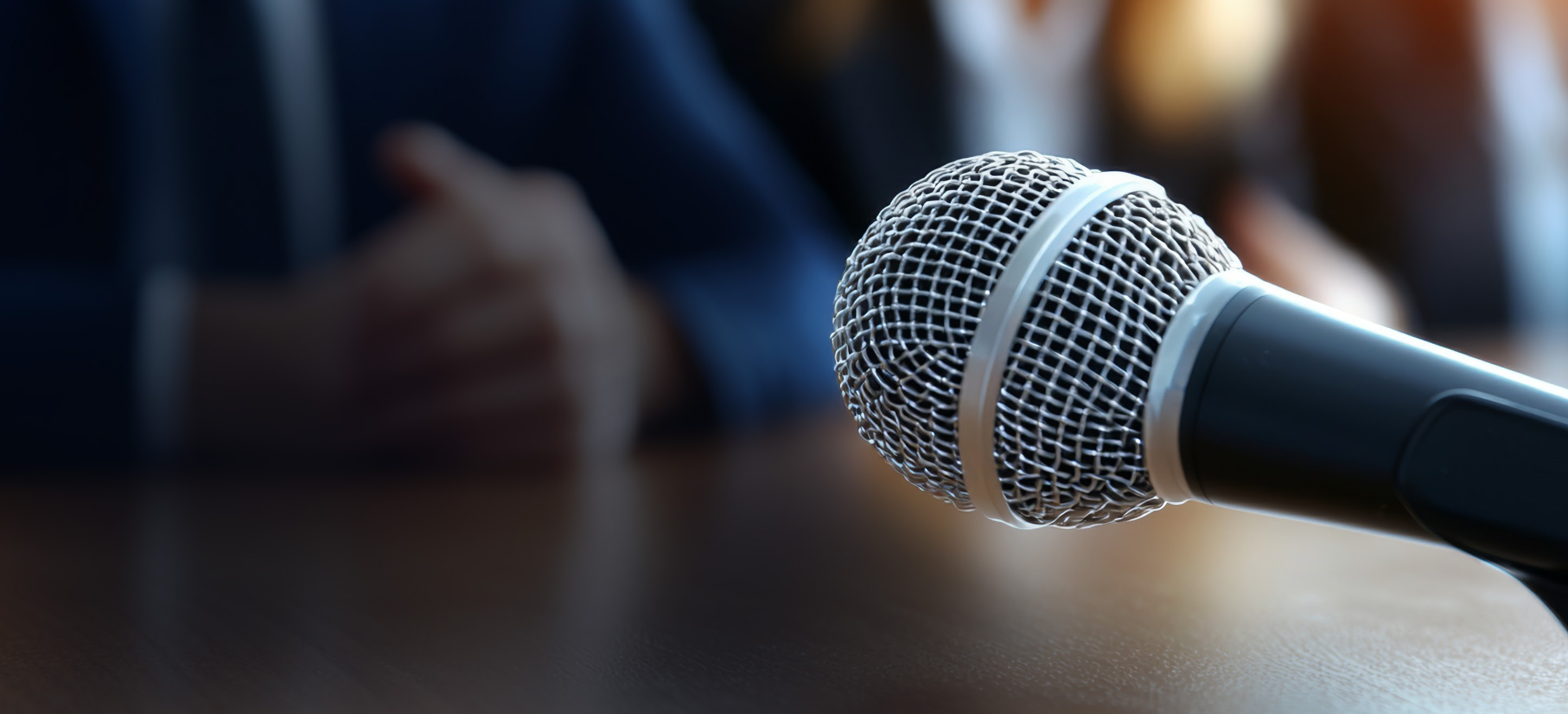 Closeup of microphone - Agentic AI in the public sector | DXC Technology Insights