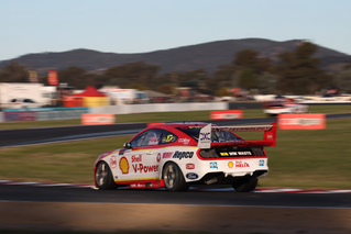 Shell V Power Racing Team car speeding around a racetrack curve, Travel & Transportation | DXC Technology Customer Stories