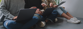 group of people working on computers, Apple | DXC Technology