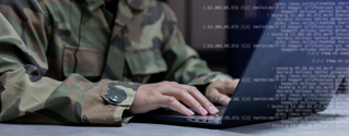 Military developer in khaki uniform, coding at a laptop, Agile and DevSecOps | DXC Technology Insights