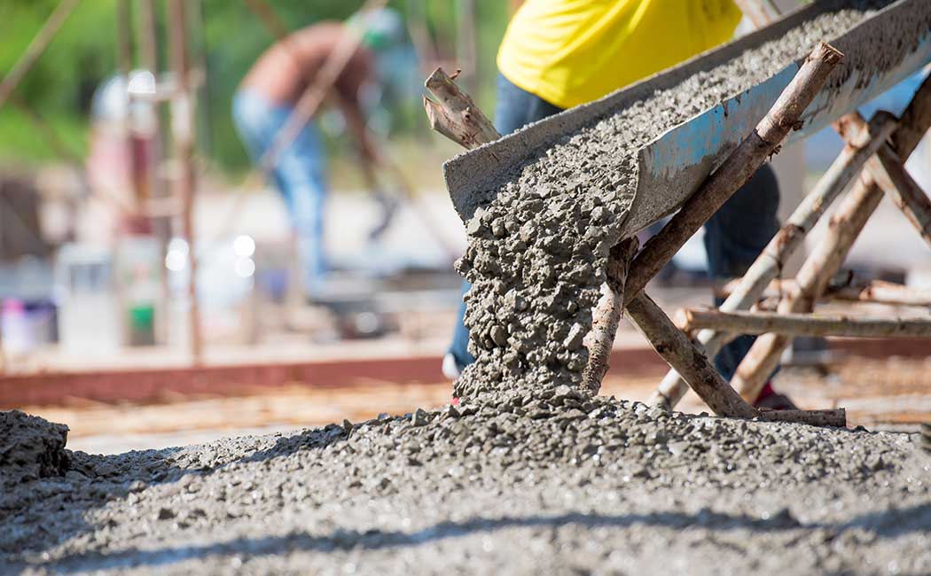Cement pouring down a chute onto construction area, Cloud & Infrastructure, SCG moves SAP to Google Cloud | DXC Technology