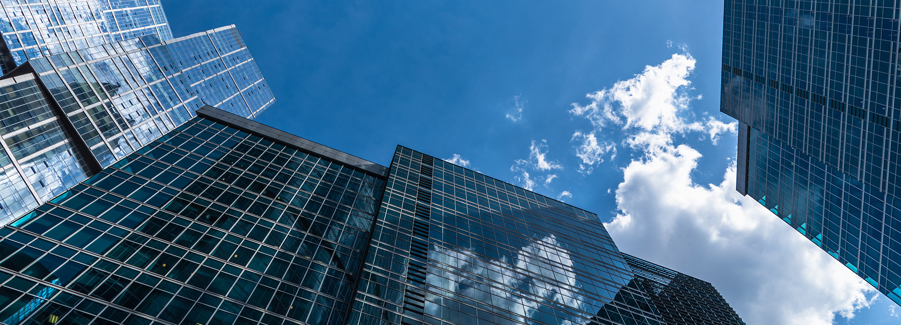 Office buildings rising to clouds, Cloud & Infrastructure | DXC Technology Insights