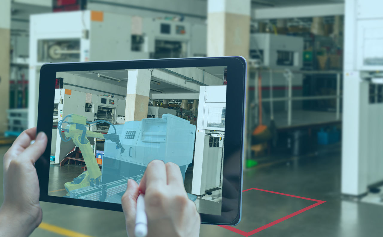 smart manufacturing ,industry 4.0, 5.0 technology concept, man use augmented mixed virtual reality technology to manage and simultion to install new machine in the factory predict, analytic how to fit