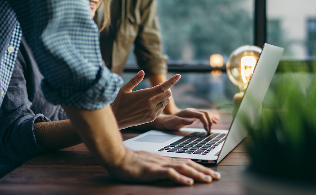 Young business people working together on new project. Colleagues at coworking. Startup concept.