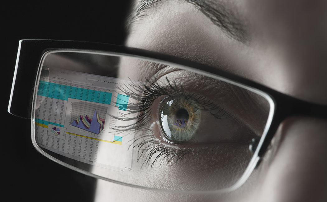 woman with view of chart in her eyeglasses, Cloud & Infrastructure | DXC Technology customer story