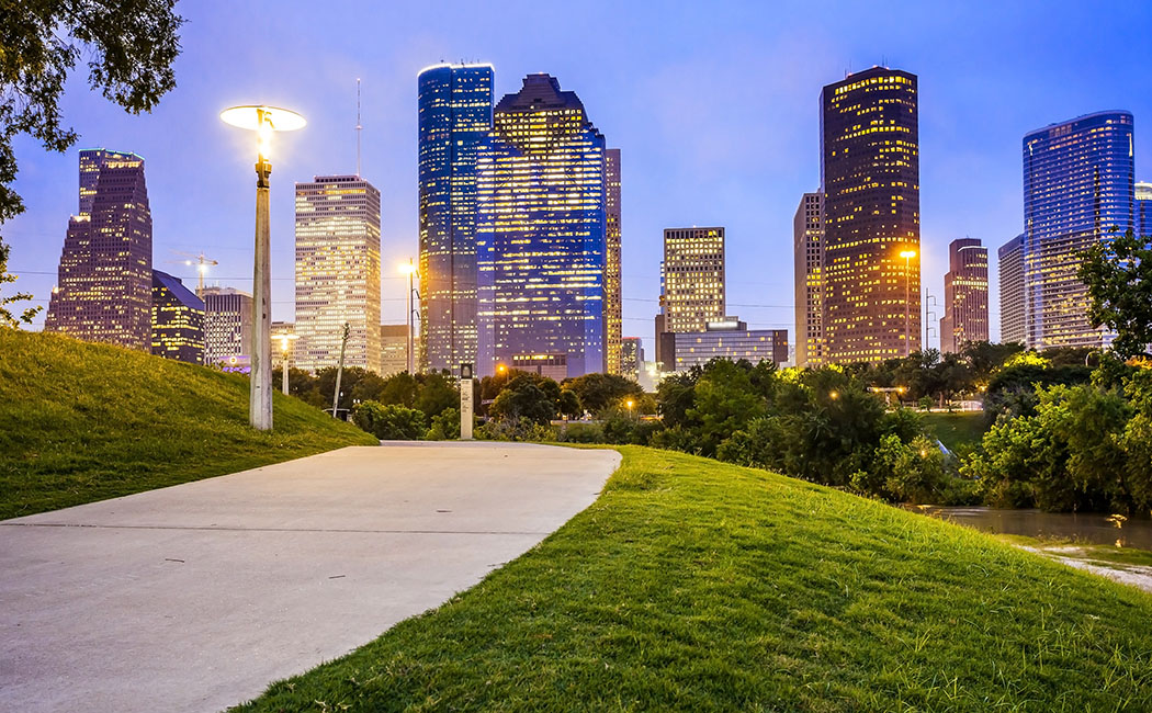 Houston city skyline as night falls and Eleanor Tinsley Park