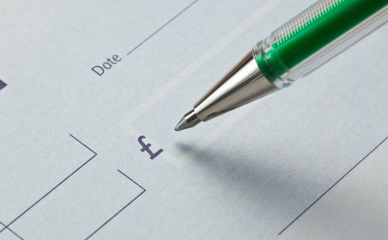 Writing a cheque with green ink