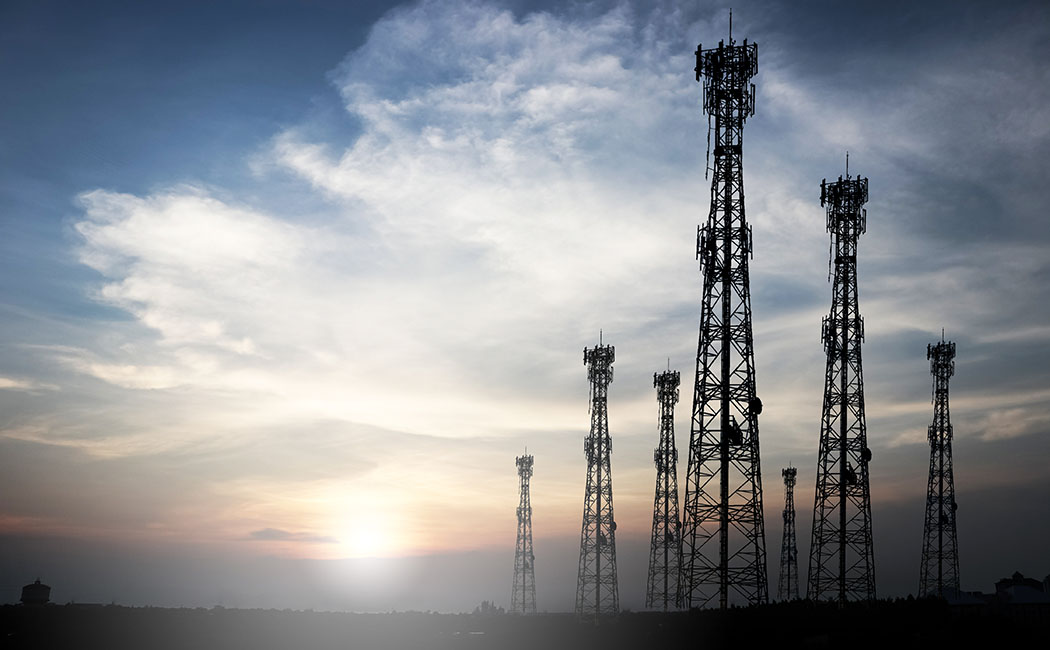 Telecommunication tower with sunset background Communicate