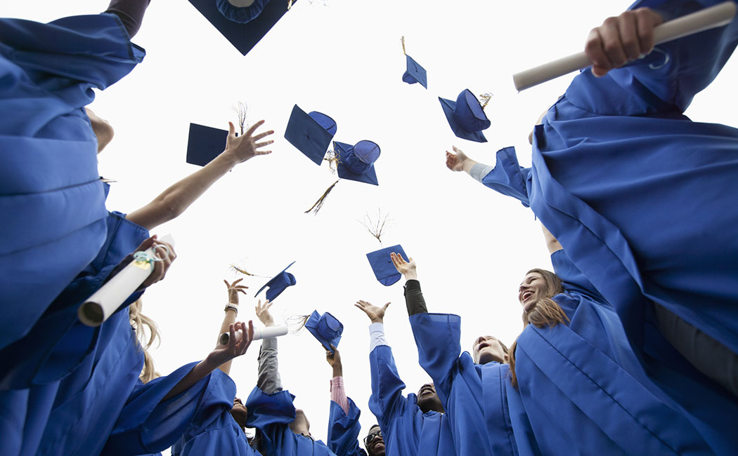 26 Apr 2012 --- Graduates throwing caps in the air. --- Image by © Hero/Corbis