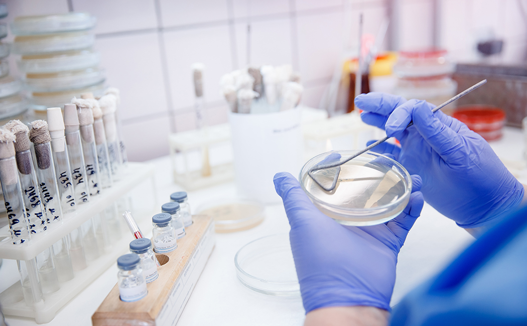 medical technician working with chemicals, AWS, DXC Technology 